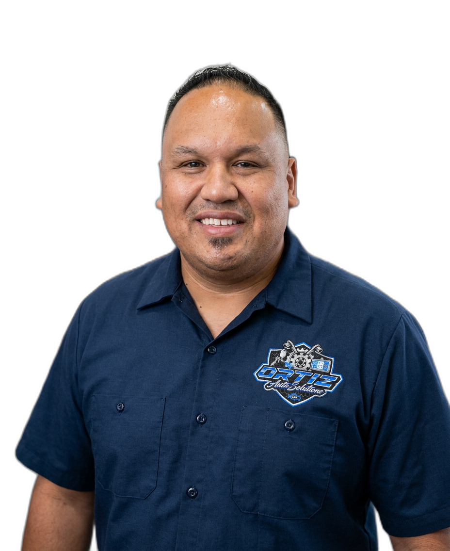 Berto Ortiz, owner of Ortiz Auto Solutions, standing in the shop